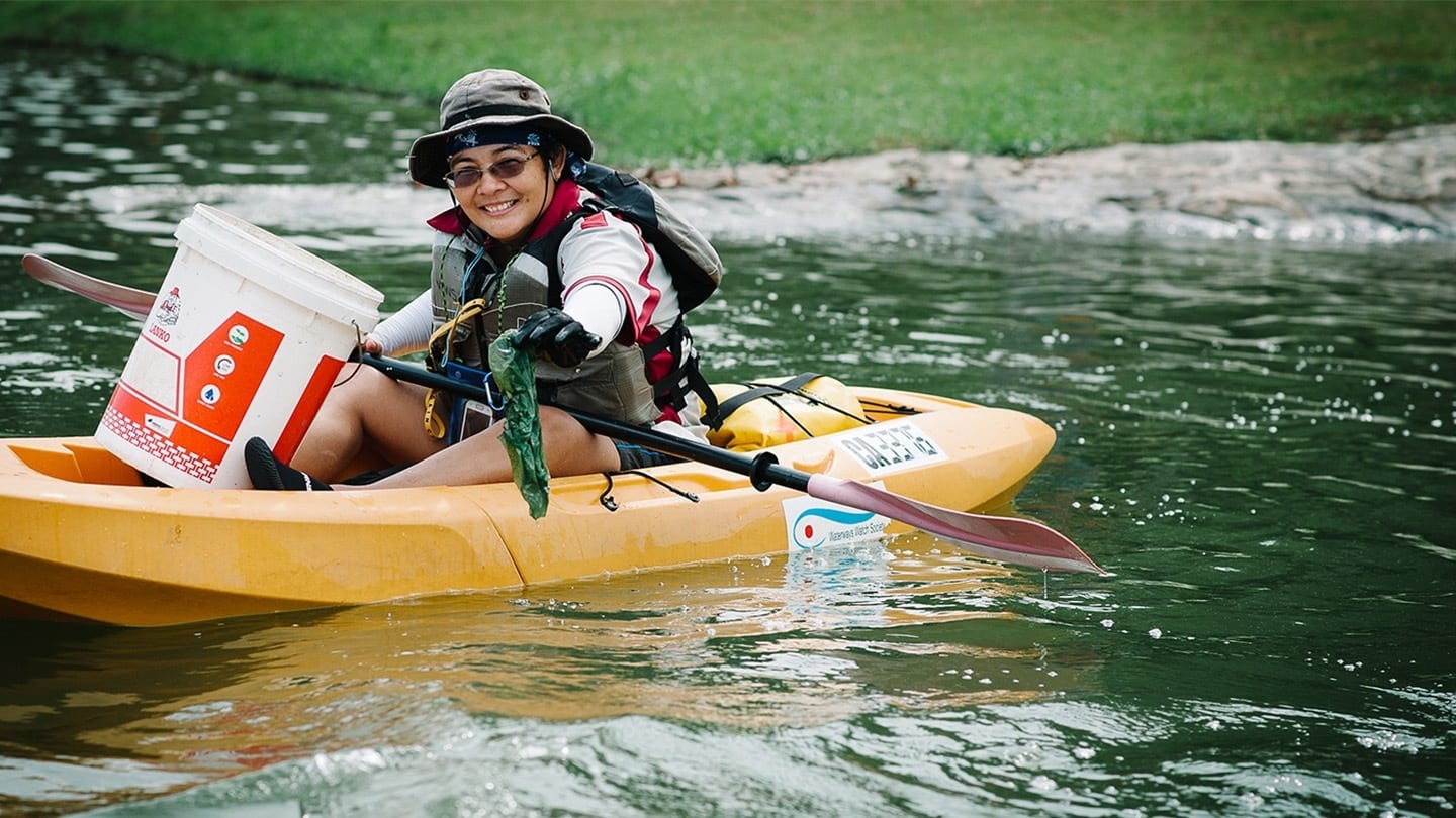 male volunteer cleaning up waterways