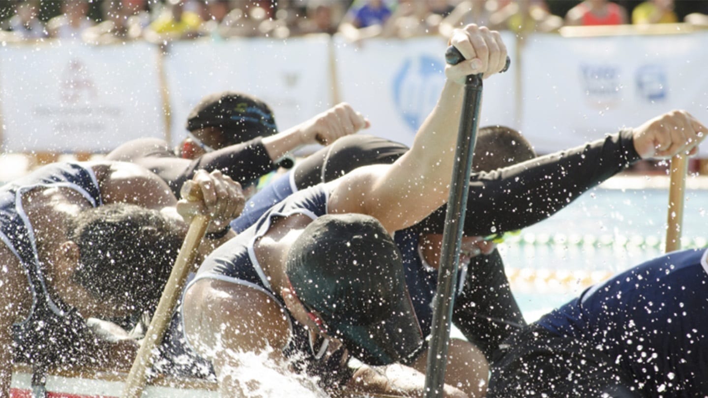 participants of a canoeing race paddling hard