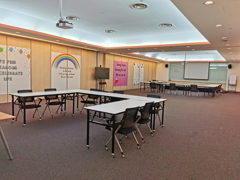 conference room two sets of tables in U shape formation