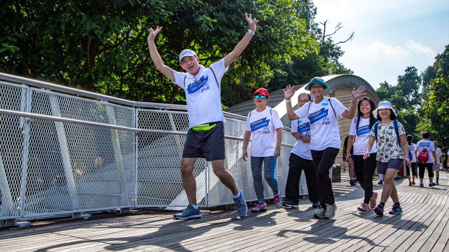 senior participants in white shirt at the front walking at henderson waves