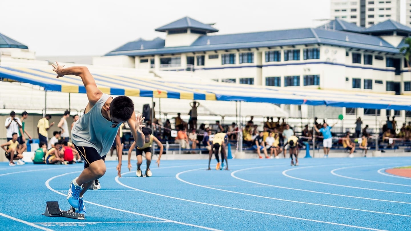 track and field competitors shooting off during a race