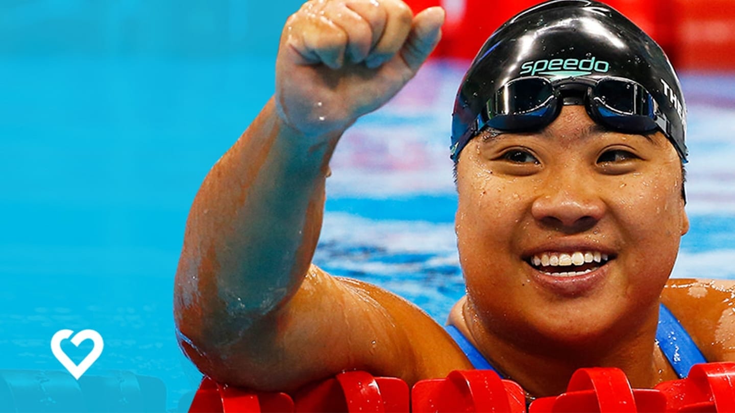 female swimmer winning a race