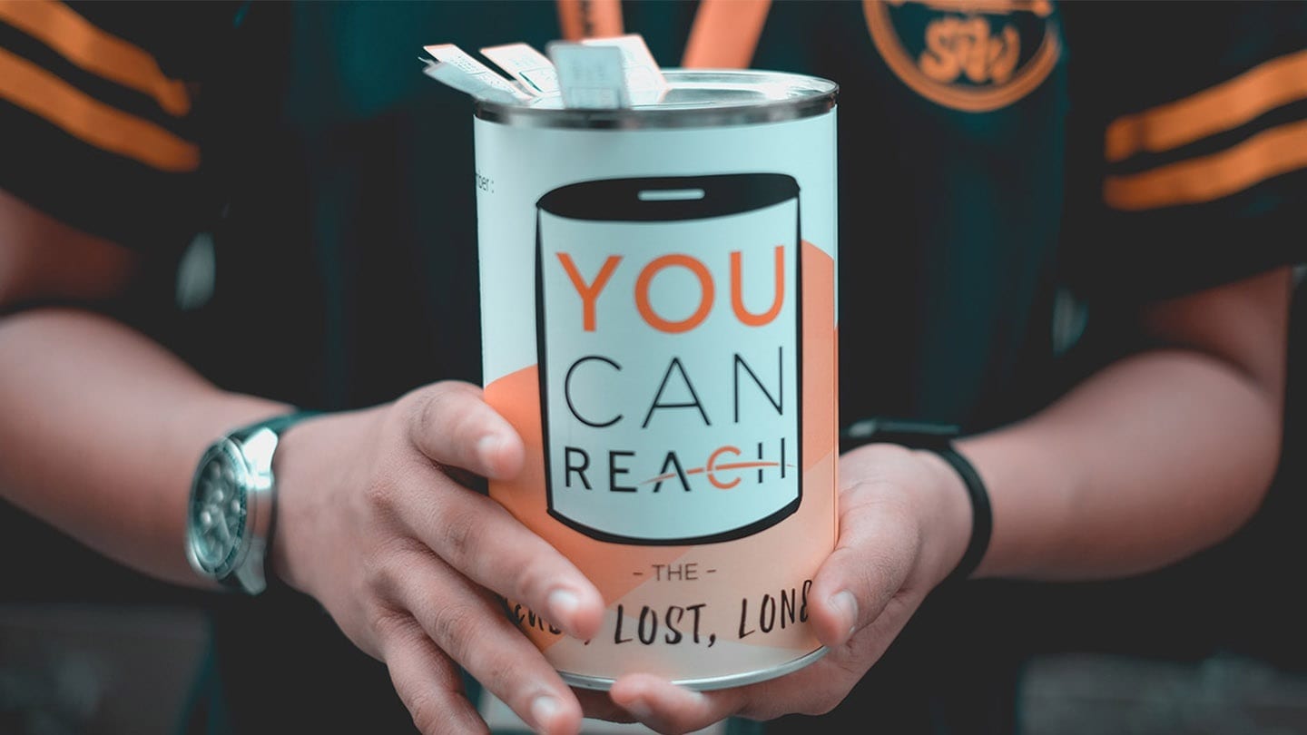 flag day donation tin saying you can reach