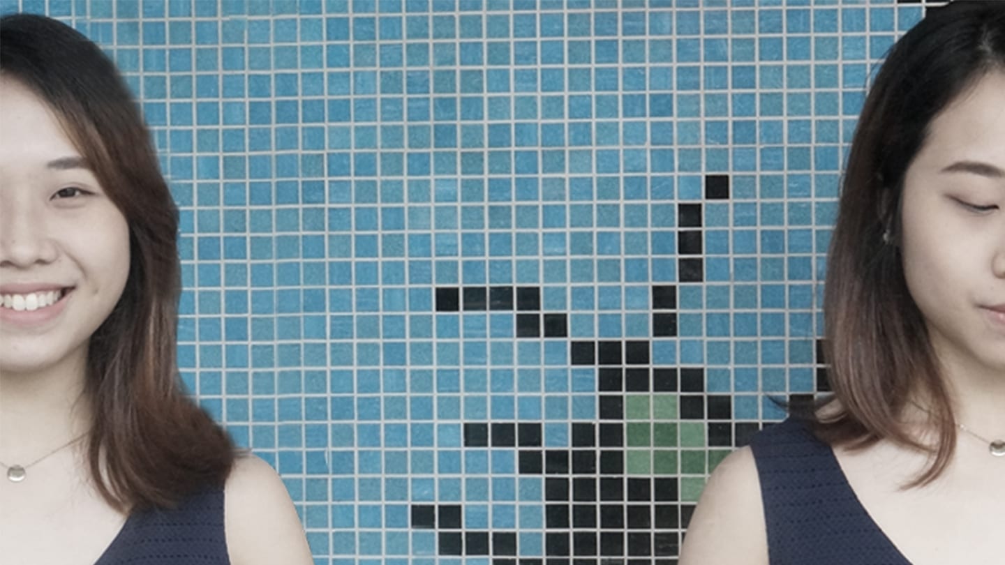 girls posing in front of blue tiled wall