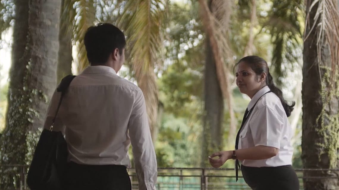 indian woman and chinese man in white shirts