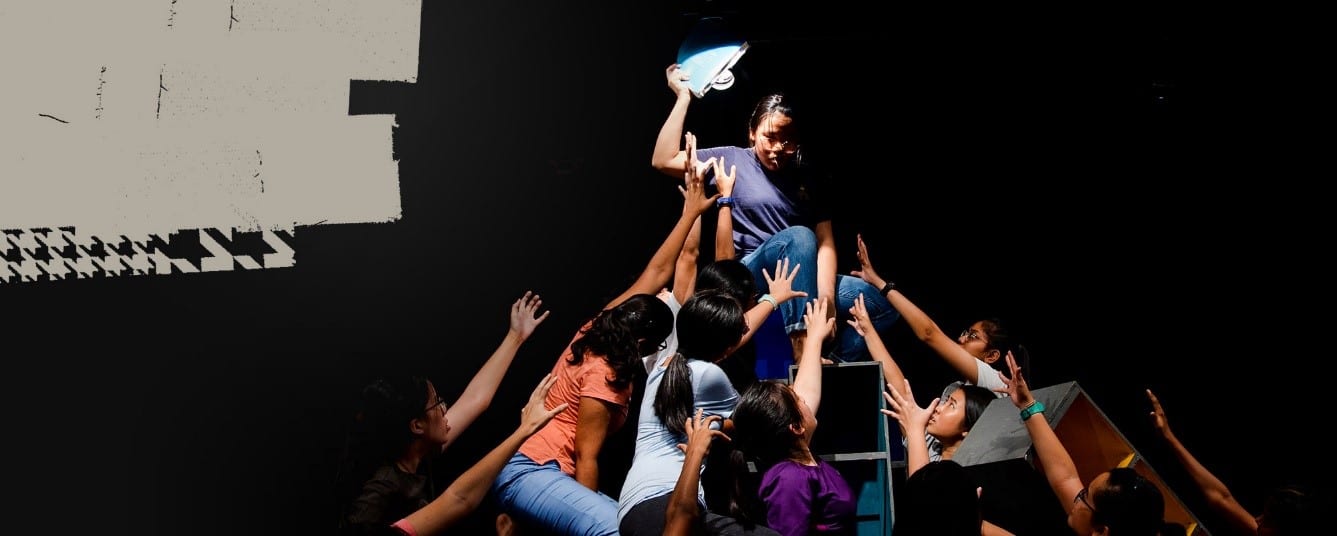 group of girls acting in a play