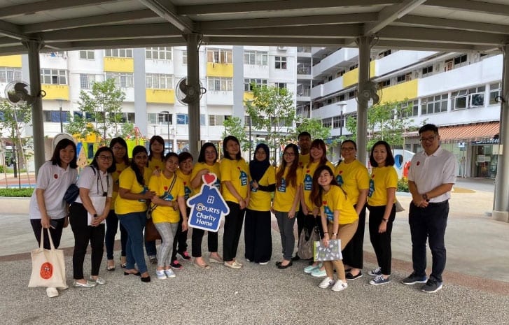 volunteers at courts charity home posing for a picture