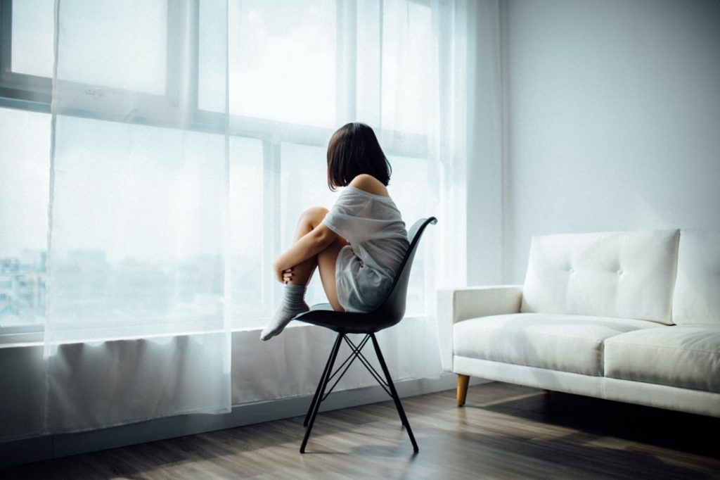 girl looking out window