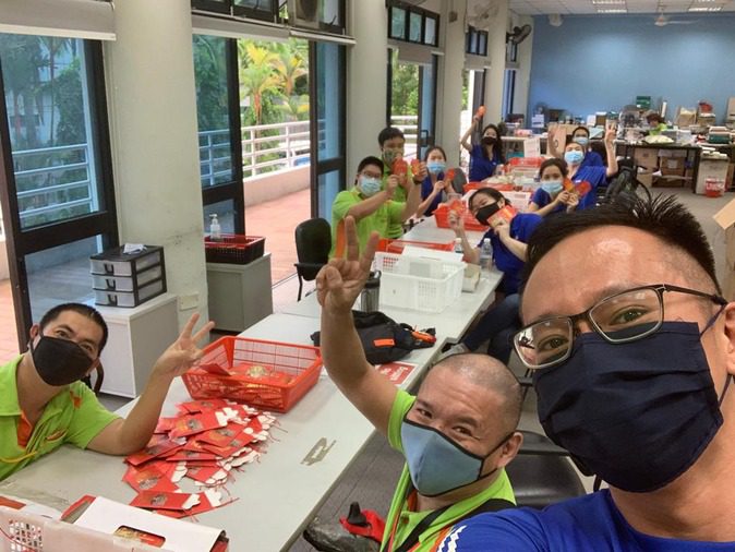 Edmund leading a selfie at SPD Sheltered Workshop