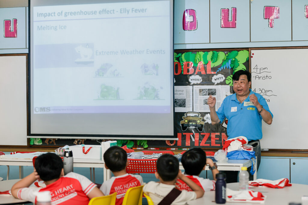 What Is Corporate Volunteering?: How and Why Singapore Companies Can Grow By Giving Back 3 a staff volunteer from oms oilfield services engaging children at big heart student care through project v