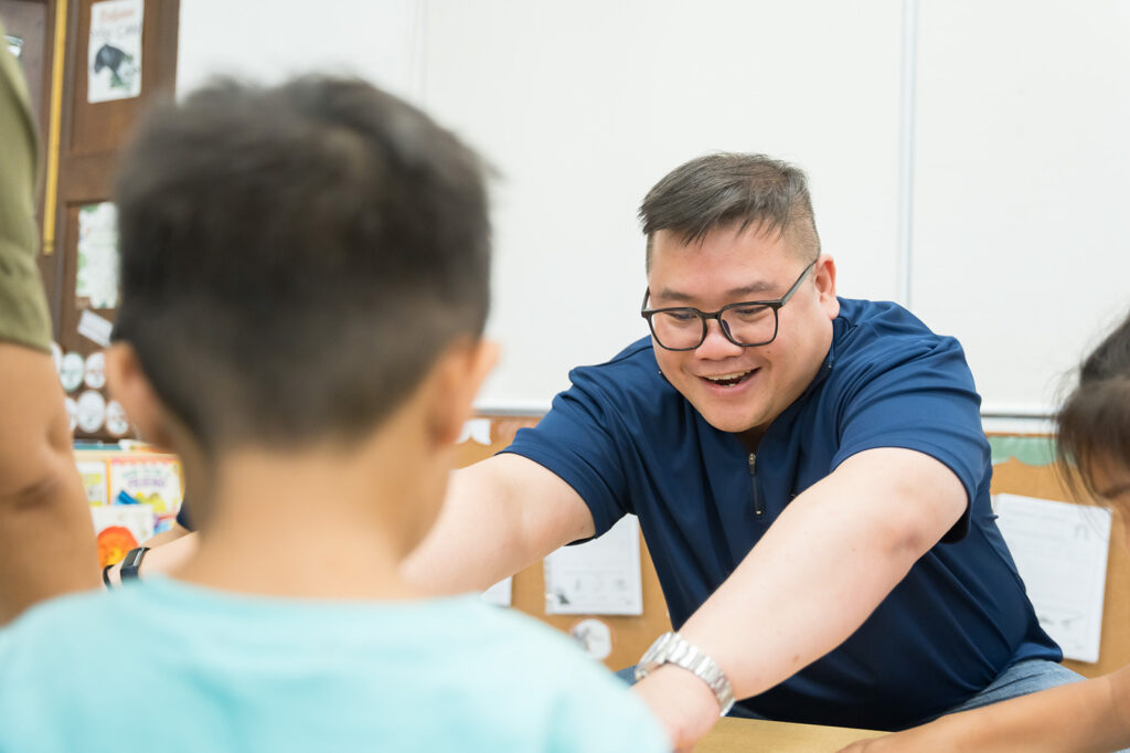 What Is Corporate Volunteering?: How and Why Singapore Companies Can Grow By Giving Back 1 nespresso staff volunteering with children at canossaville through project v