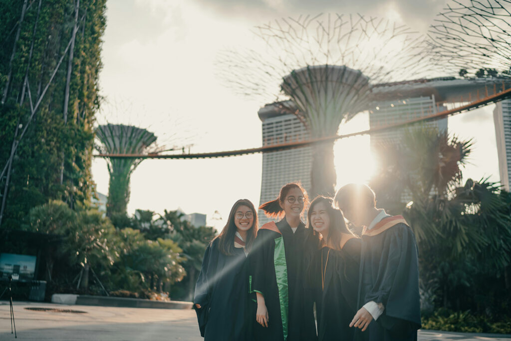graduating university students at gardens by the bay photo by albert vincent wu unsplash