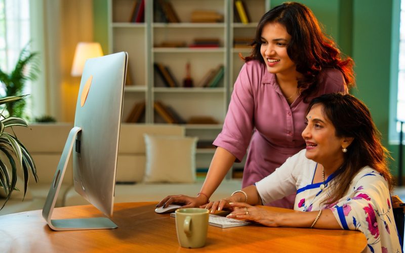 mother and daughter using a computer